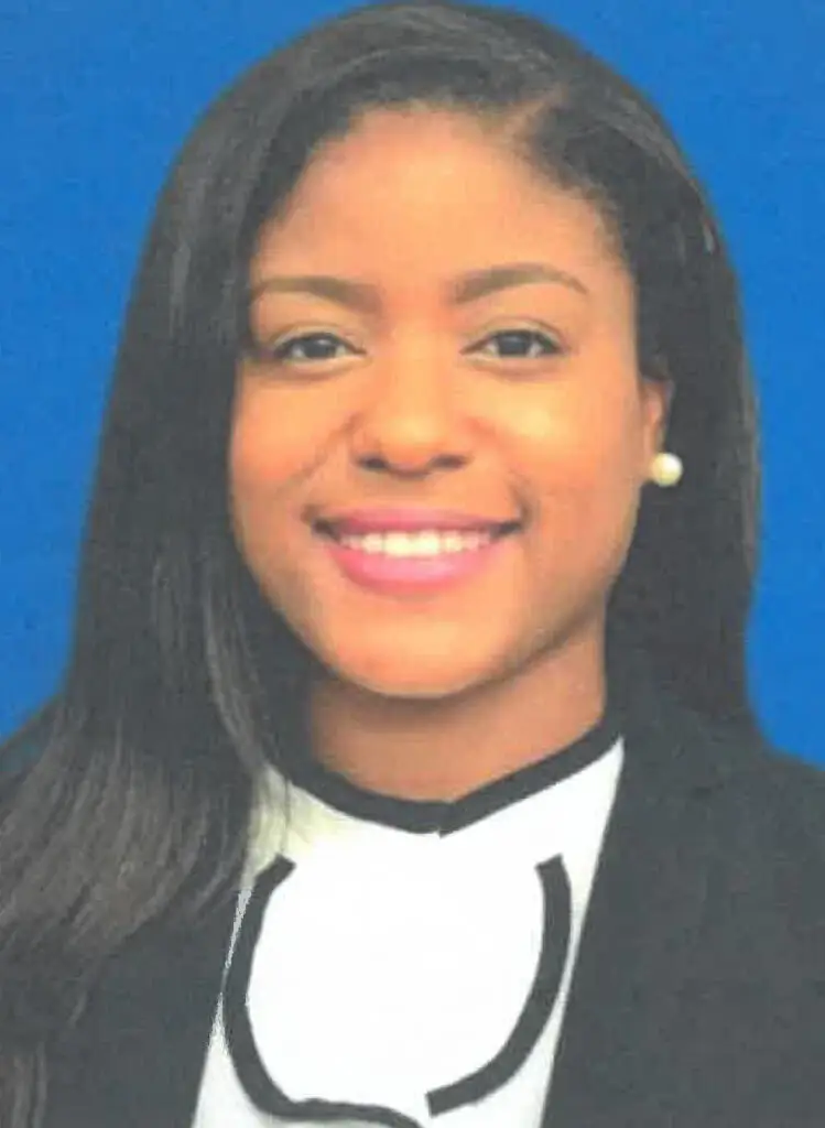 Marianalyn Coleman smiling at the camera with a blue background